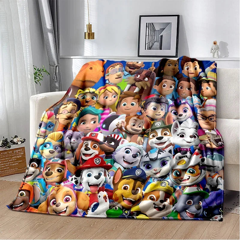 Plaid multicolore motif Chiots Pat Patrouille, visages de chiens dessinés.