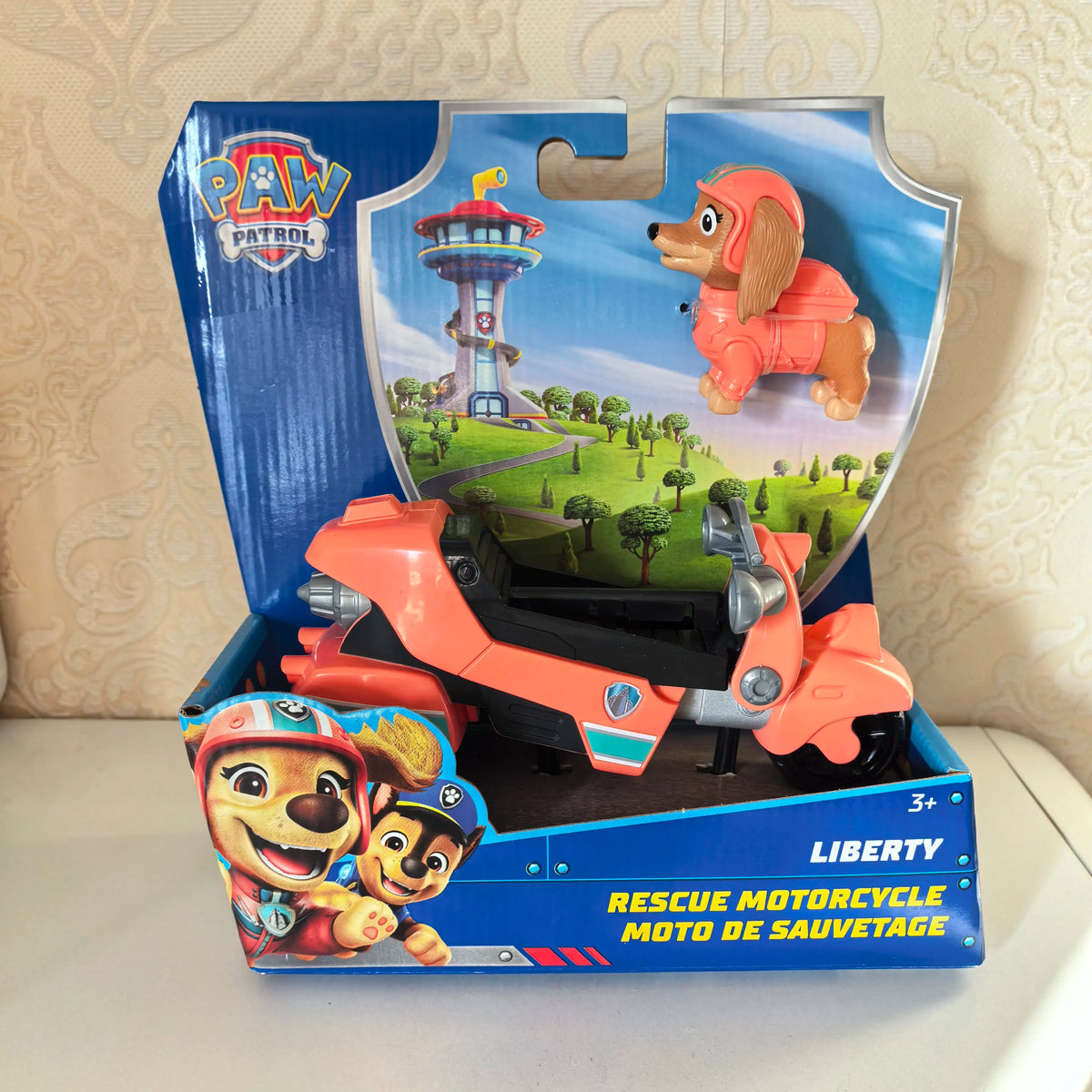 Moto de sauvetage Liberty Pat Patrouille en boîte, figurine chien orange et véhicule.