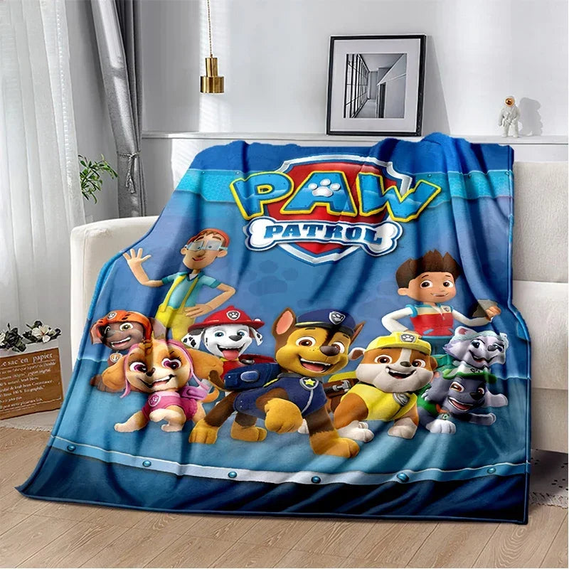 Couverture en tissu bleu avec motif logo et personnages Pat'Patrouille