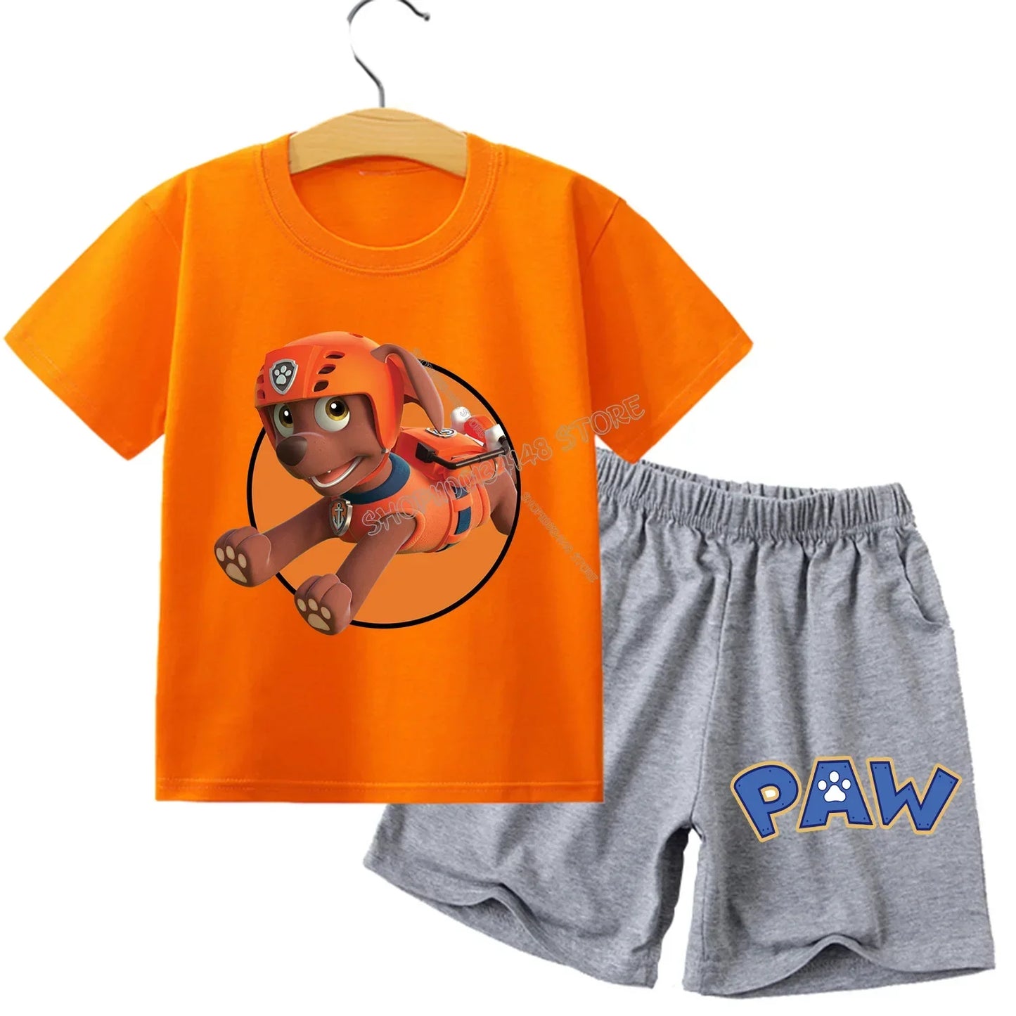 Pyjama enfant Pat' Patrouille orange motif Zuma, porté par un enfant