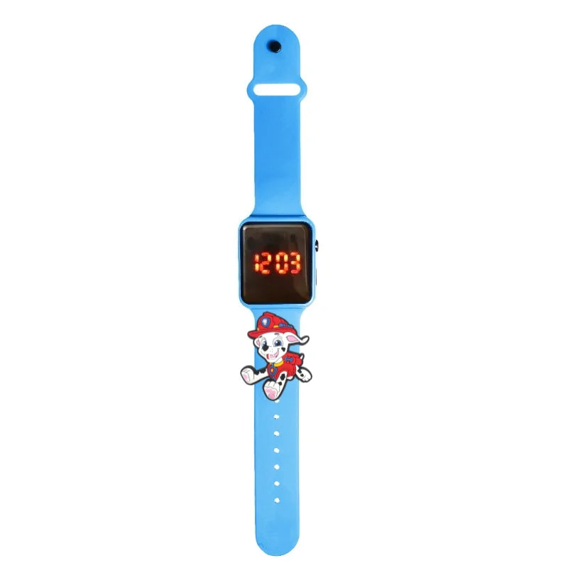 Montre LED enfant Pat Patrouille, bracelet bleu clair en silicone, écran digital rouge.