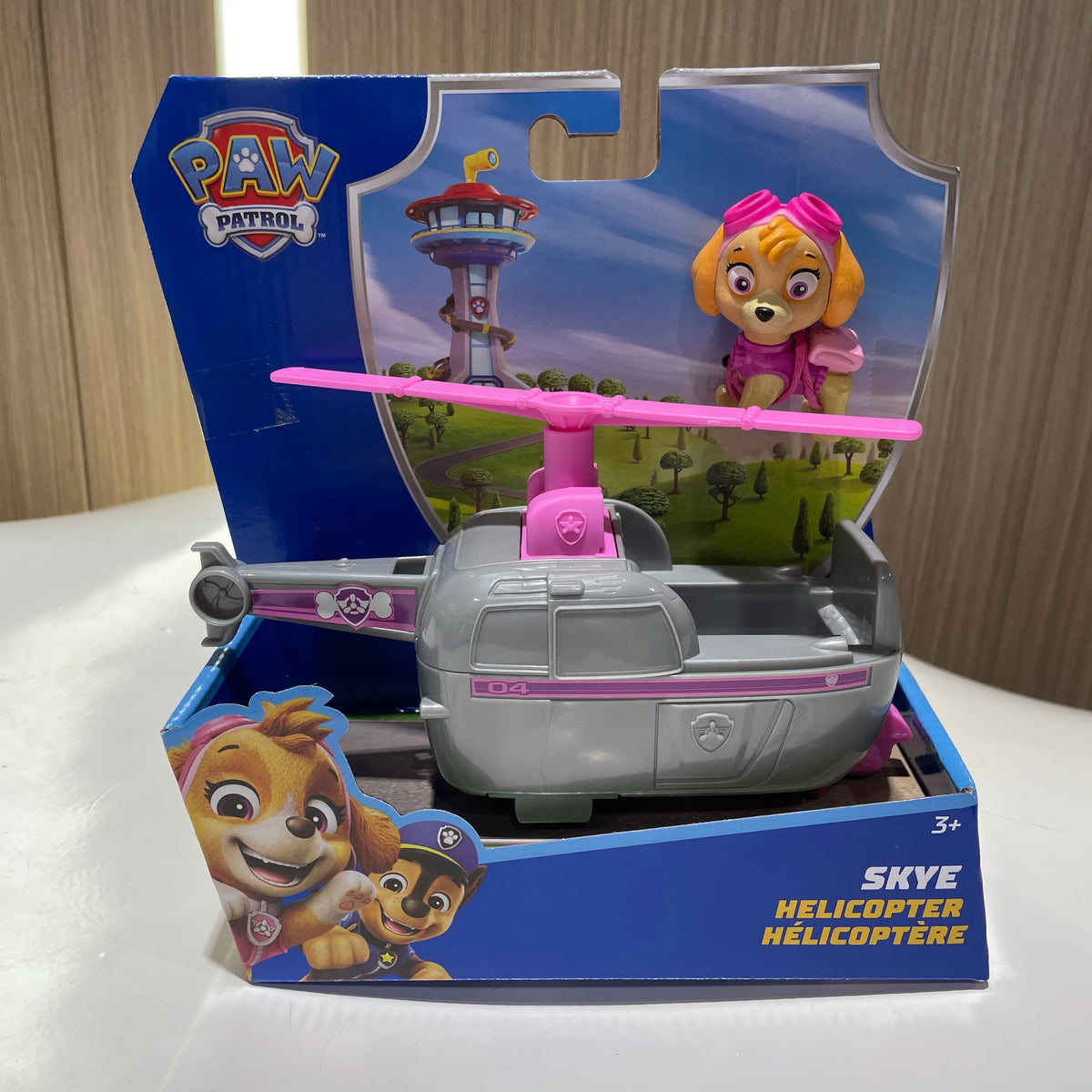 Hélicoptère Pat' Patrouille Stella rose et gris dans sa boîte de jeu