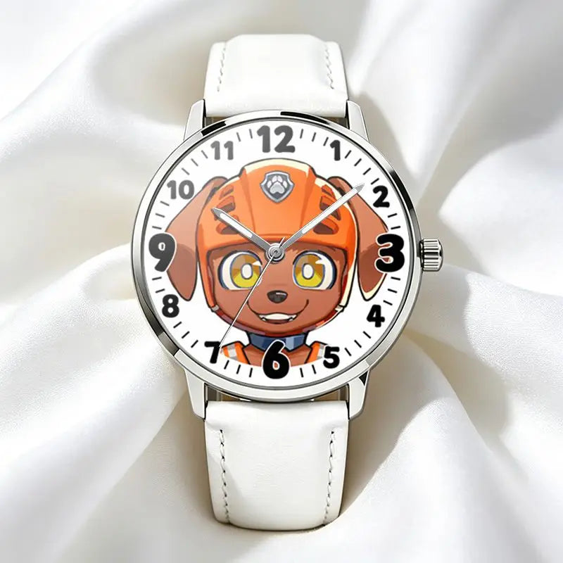 Montre Pat Patrouille Zuma à cadran personnage orange, bracelet blanc et boîtier argent.