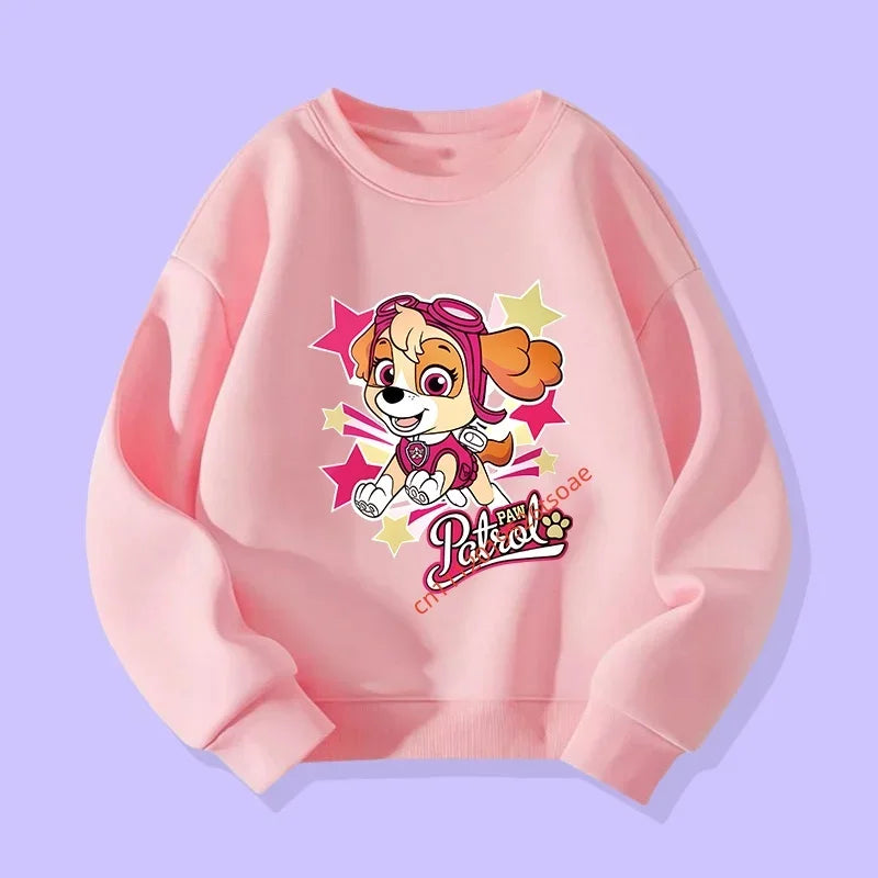Pull rose pâle à manches longues avec applique Pat'Patrouille et étoiles multicolores.