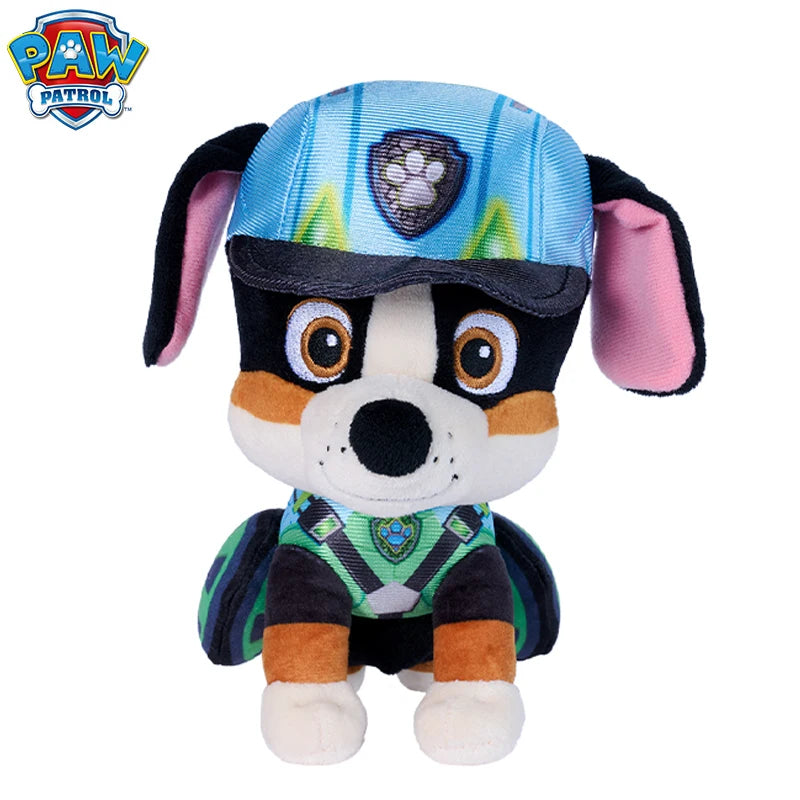 Peluche Pat Patrouille Rex chien bleu et noir, tenue verte, yeux marron, pattes blanches.