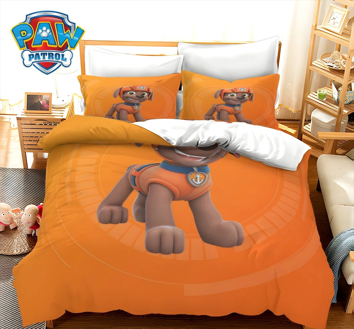 Parure de lit orange Zuma avec personnage chien sur housse de couette et taies assorties