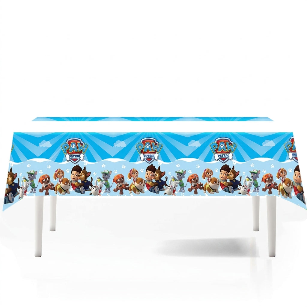 Nappe Pat' Patrouille bleu ciel à nuages 108 × 180 cm, frise des chiots, dressée sur une table